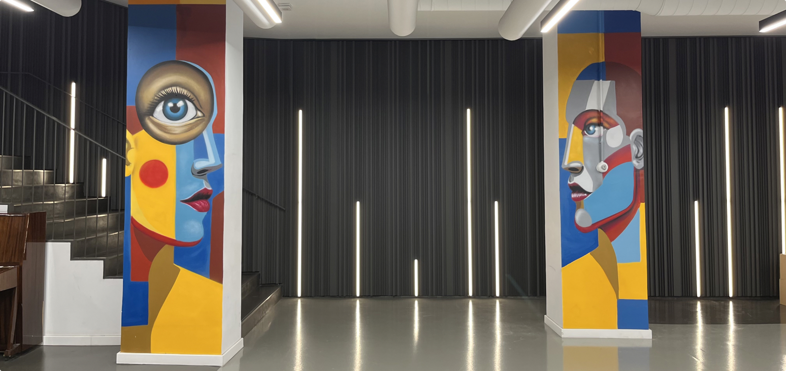 Completed school mural across a full wall