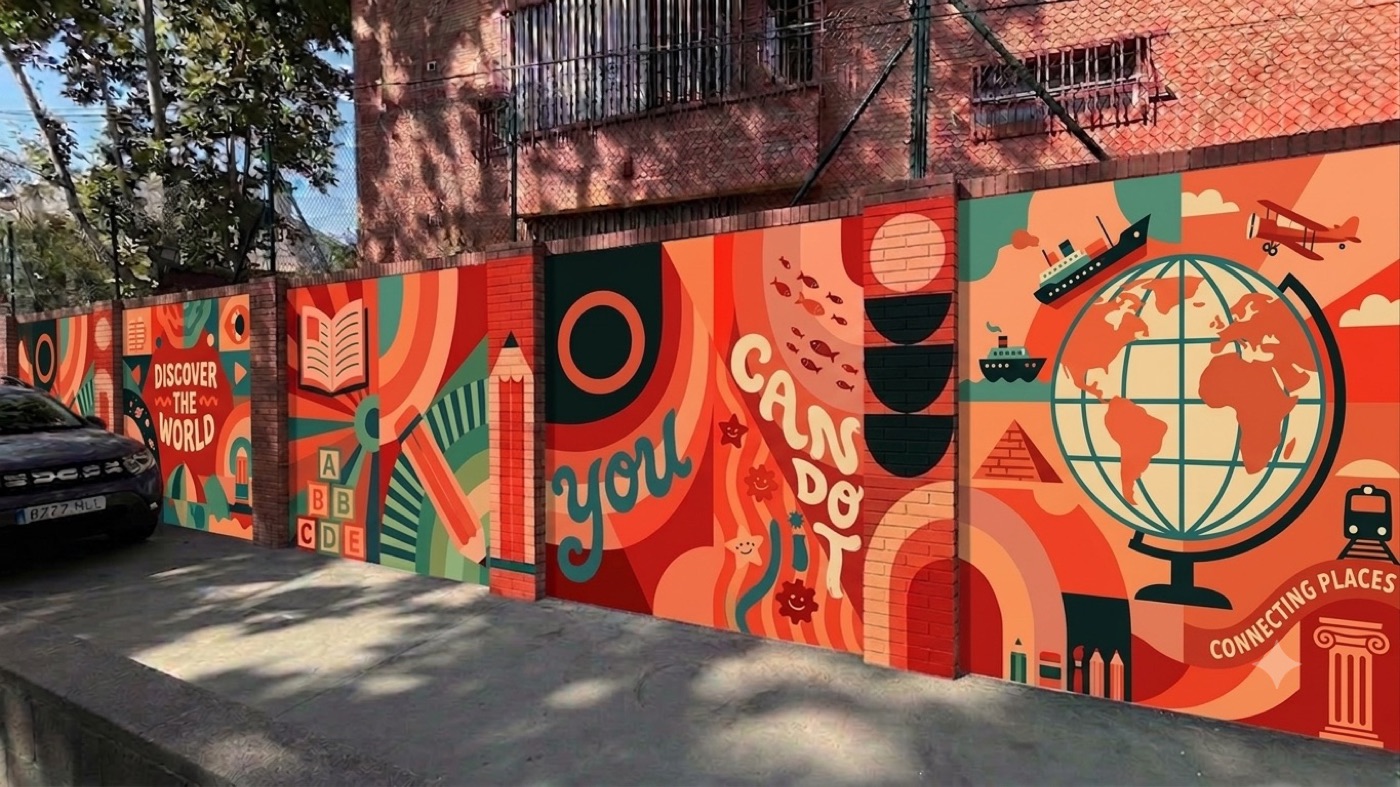 Discover the World mural with a globe, plane and ship along a school wall