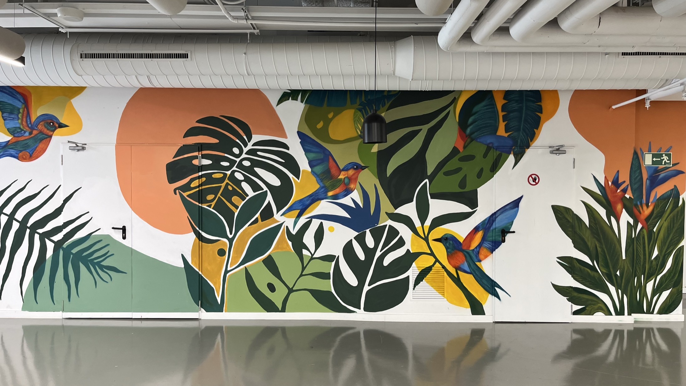 Completed mural across a long interior wall
