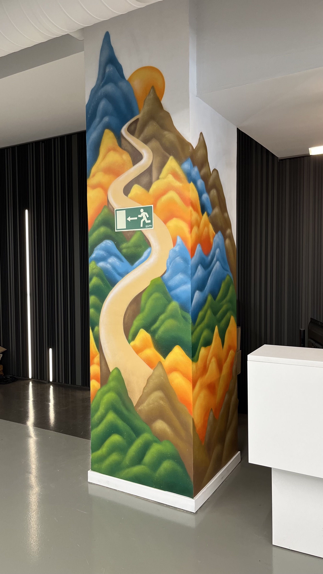 Mural panels with plants in an office corner