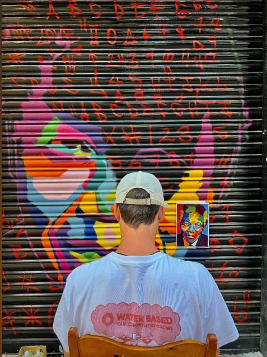 Studio team painting a bold graphic mural